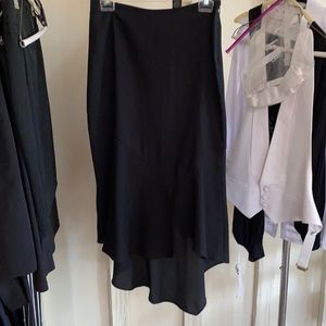 Cocktail length black skirt